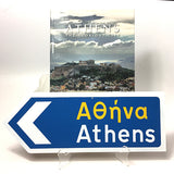 Athens Greek Road Sign with an arrow pointing the left with the Athens book.